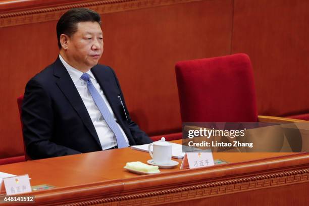 Chinese President Xi Jinping attends the opening session of the National People's Congress at The Great Hall of People on March 5, 2017 in Beijing,...