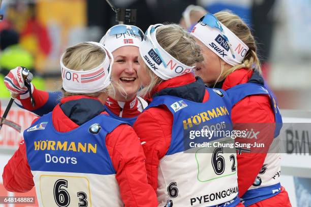 Kaia Woeien Nicolaisen, Hilde Fenne, Tiril Eckhoff and Marte Olsbu of Norway celebrate after the Women's 4x6km relay during the BMW IBU World Cup...