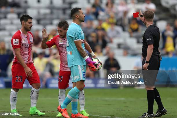 Paul Izzo of the Mariners is shown a red card after colliding with Bruno Fornaroli of Melbourne City during the round 22 A-League match between the...