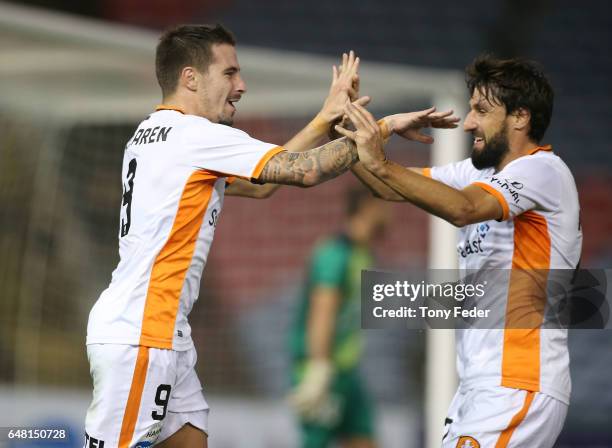 Jamie Maclaren and Thomas Broich of the Roar celebrate a goal during the round 22 A-League match between the Newcastle Jets and the Brisbane Roar at...