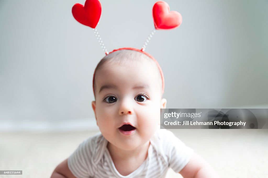 Valentine's Day Baby Poses for Camera