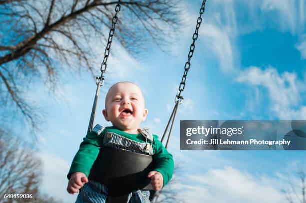7 month fraternal twin baby swings - balding stock pictures, royalty-free photos & images