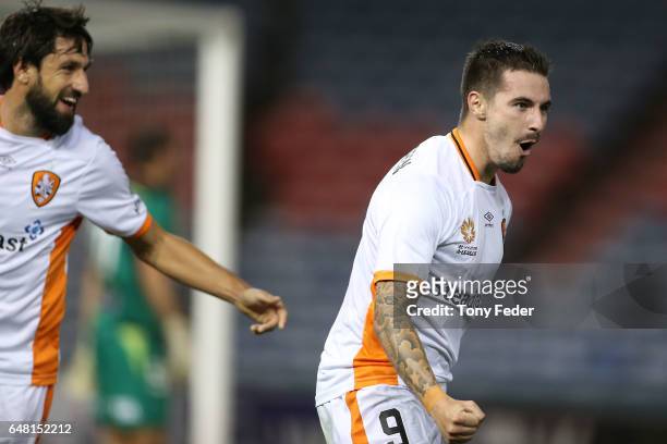 Jamie Maclaren and Thomas Broich of the Roar celebrate a goal during the round 22 A-League match between the Newcastle Jets and the Brisbane Roar at...