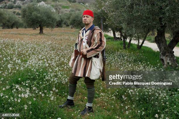 Historical re-enactor Jose Gil Perujo dressed as Franco's troop Falange Morocco Batallion poses for a portrait before a re-enactment of the Battle of...