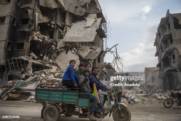 Syrians who have returned to their home after the Al Bab town center has been entirely freed from Daesh terrorists as part of the "Operation...