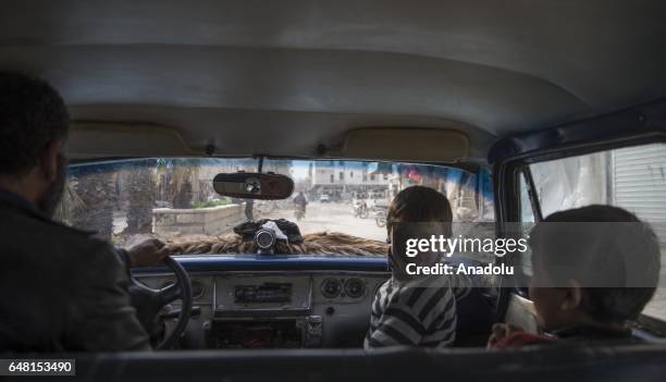 Syrians who have returned to their home after the Al Bab town center has been entirely freed from Daesh terrorists as part of the "Operation...