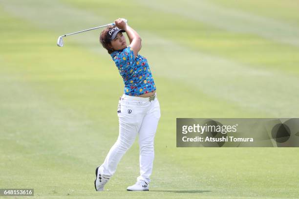 Ai Suzuki of Japan hits her second shot on the 12th hole during the final round of the Daikin Orchid Ladies Golf Tournament at the Ryukyu Golf Club...