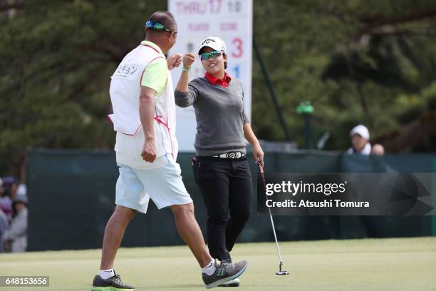 Hee-Kyung Bae of South Korea celebrates after making her birdie putt on the 18th green during the final round of the Daikin Orchid Ladies Golf...