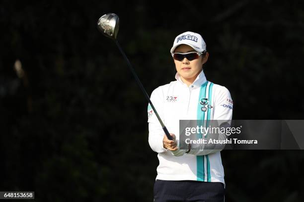 Rie Tsuji of Japan lines up her tee shot on the 11th hole during the final round of the Daikin Orchid Ladies Golf Tournament at the Ryukyu Golf Club...