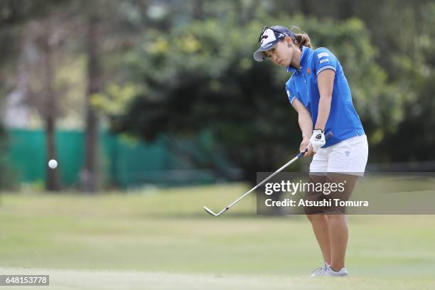 Momoko Ueda of Japan chips onto the 12th green during the final round of the Daikin Orchid Ladies Golf Tournament at the Ryukyu Golf Club on March 5,...