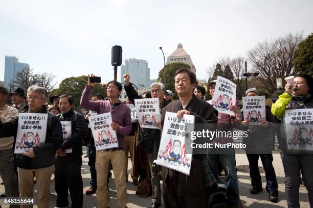 Anti-Abe protesters with placards gather in front of the National Diet Building to protest against the policies of Shinzo Abe and to call on the...