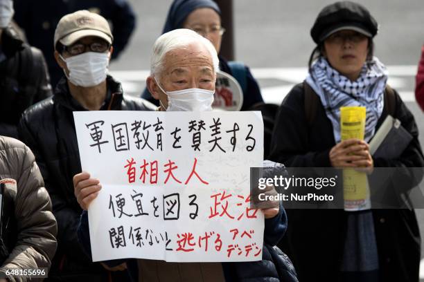 Anti-Abe protesters with placards gather in front of the National Diet Building to protest against the policies of Shinzo Abe and to call on the...