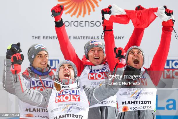 Team Poland - Maciej KOT, Kamil STOCH, Dawid KUBACKI and Piotr ZYLA celebrate after they take the Gold in Men Large Hill Team final in ski jumping,...