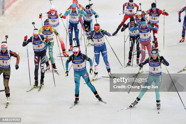 Anais Chevalier of France and Iryna Varvynets of Ukraine lead the pack in the Women's 4x6km relay during the BMW IBU World Cup Biathlon 2017 - test...