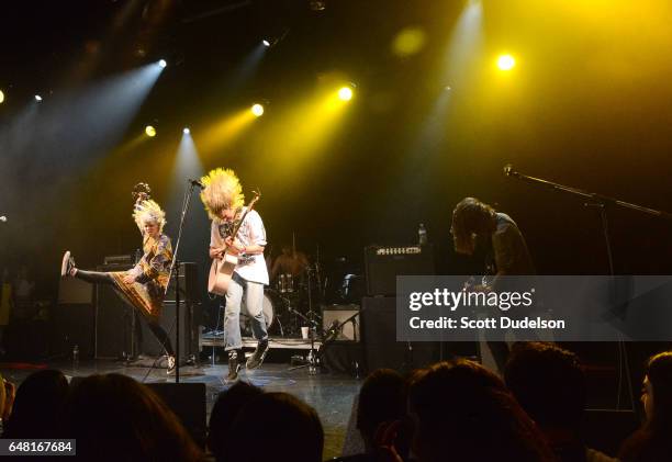 Singers Andrew Wessen Hannah Hooper and Christian Zucconi of Grouplove perform onstage during the "Don't Site Down: Planned Parenthood Benefit...