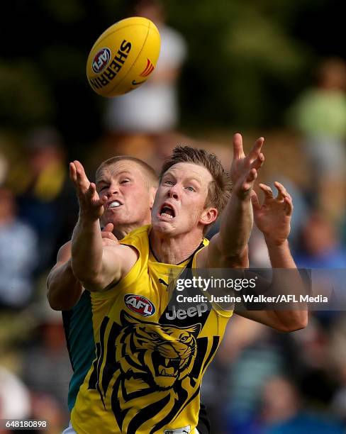 Jack Riewoldt of the Tigers contests the mark with Tom Clurey of the Power during the AFL 2017 JLT Community Series match between Port Adelaide Power...