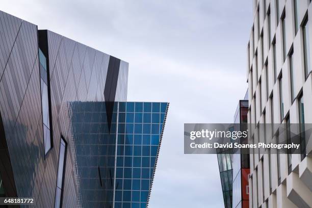 modern buildings surrounding grand canal square in dublin city, ireland - dublin city stock pictures, royalty-free photos & images