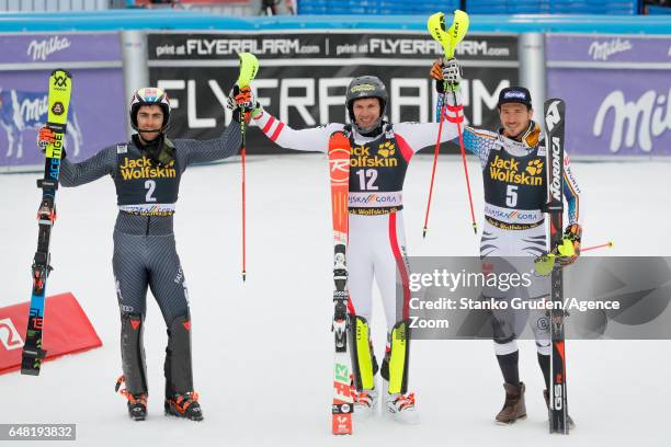 Stefano Gross of Italy takes 2nd place, Michael Matt of Austria takes 1st place, Felix Neureuther of Germany takes 3rd place during the Audi FIS...