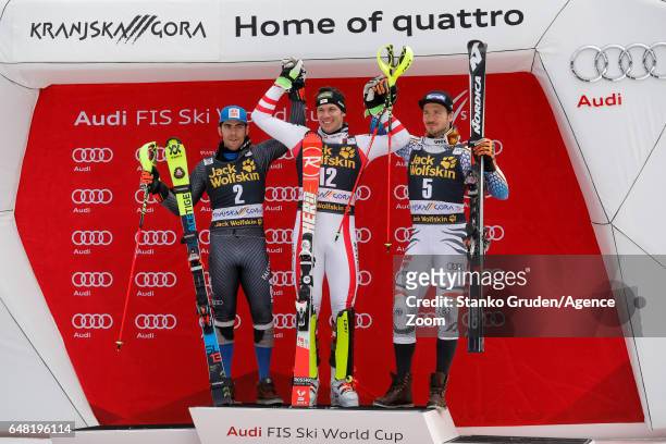 Stefano Gross of Italy takes 2nd place, Michael Matt of Austria takes 1st place, Felix Neureuther of Germany takes 3rd place during the Audi FIS...
