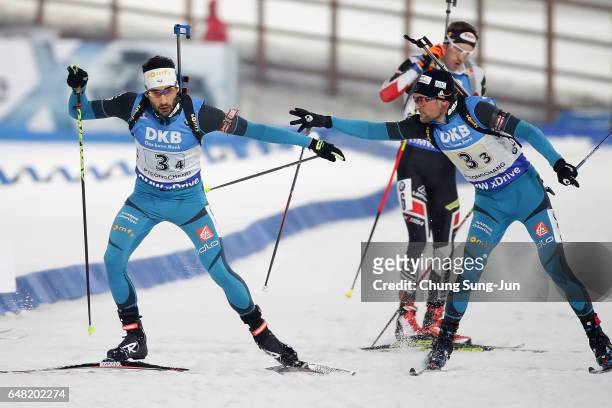 Simon Desthieux of France tags Martin Fourcade of France competes in the Men's 4x7.5 Km Relay during the BMW IBU World Cup Biathlon 2017 - test event...