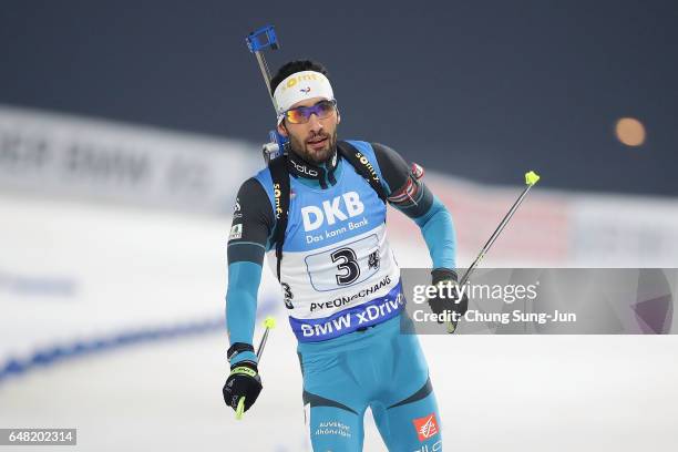 Martin Fourcade of France celebrates after winning the Men's 4x7.5 Km Relay during the BMW IBU World Cup Biathlon 2017 - test event for PyeongChang...