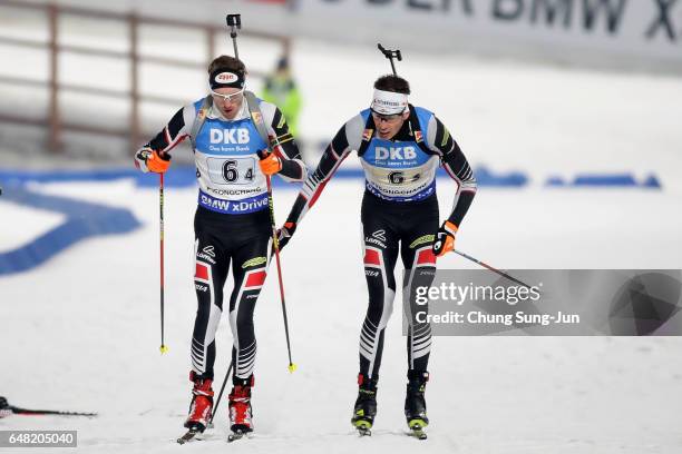 Julian Eberhard of Austria tags Dominik Landertinger of Norway in the Men's 4x7.5km Relay during the BMW IBU World Cup Biathlon 2017 - test event for...