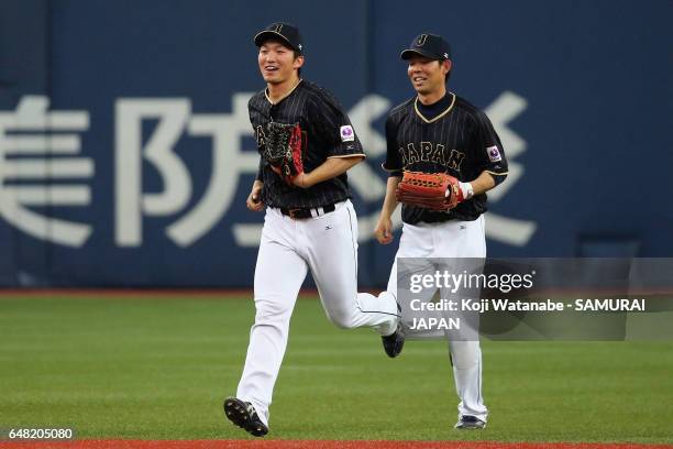 Seiya Suzuki and Outfielder Shogo Akiyama of Japan celebrate their win after the World Baseball Classic Warm-Up Game between Japan and Orix Buffaloes...