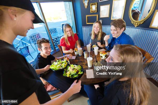 Group Ordering Group Of People Ordering Food In Deli Photos and Premium High Res ...