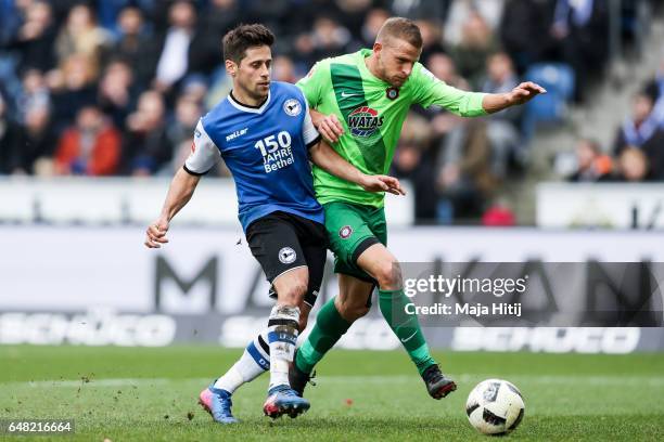 Michael Goerlitz of Bielefeld and Nicky Adler of Aue battle for the ball during the Second Bundesliga match between DSC Arminia Bielefeld and FC...