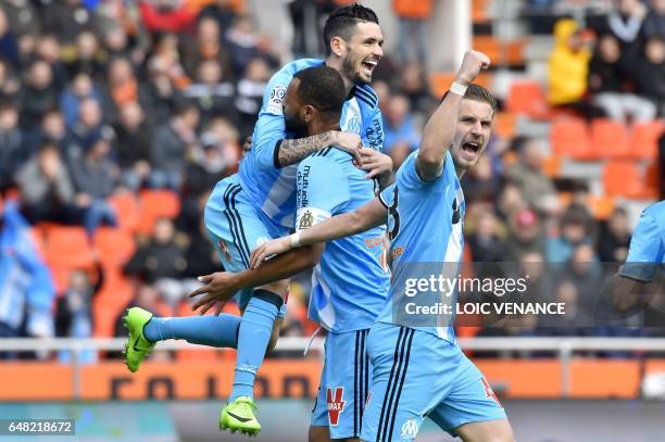 Marseille's Portuguese defender Rolando Jorge Pires Da Fonseca celebrates with teammates after scoring a goal during the French L1 football match FC...