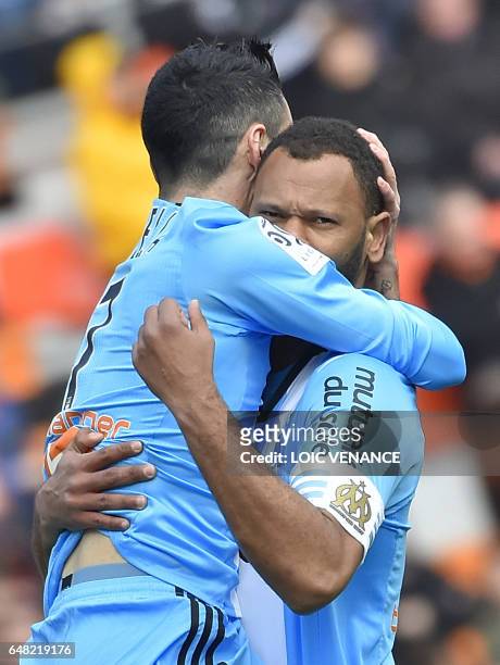 Marseille's Portuguese defender Rolando Jorge Pires Da Fonseca celebrates with his teammate after scoring a goal during the French L1 football match...