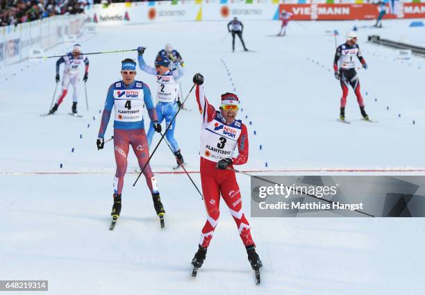 Alex Harvey of Canada celebrates winning the gold medal in the Men's Cross Country Mass Start during the FIS Nordic World Ski Championships on March...