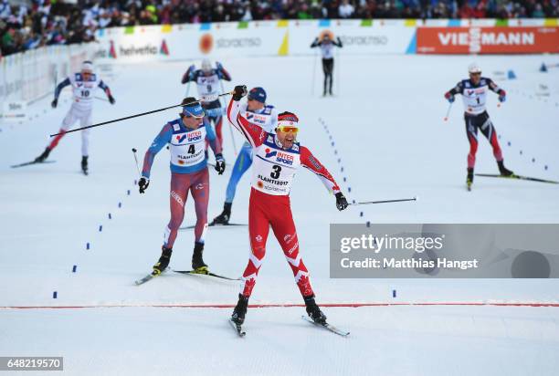 Alex Harvey of Canada celebrates winning the gold medal in the Men's Cross Country Mass Start during the FIS Nordic World Ski Championships on March...