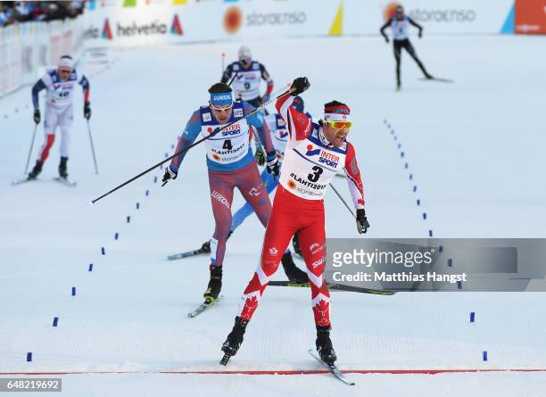 Alex Harvey of Canada celebrates winning the gold medal in the Men's Cross Country Mass Start during the FIS Nordic World Ski Championships on March...