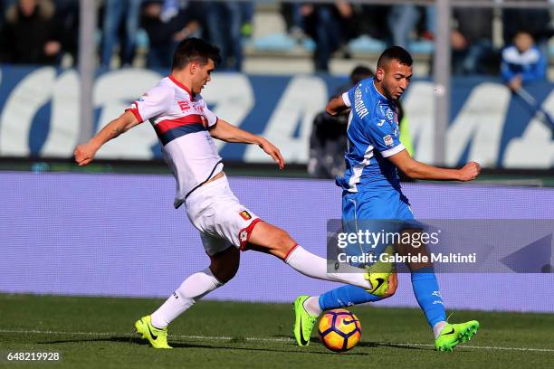 Omar El Kaddouri of Empoli FC battles for the ball with Ezequiel Matias Munoz of Genoa CFC during the Serie A match between Empoli FC and Genoa CFC...