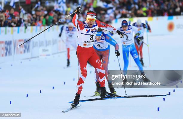 Alex Harvey of Canada celebrates winning the gold medal in the Men's Cross Country Mass Start during the FIS Nordic World Ski Championships on March...