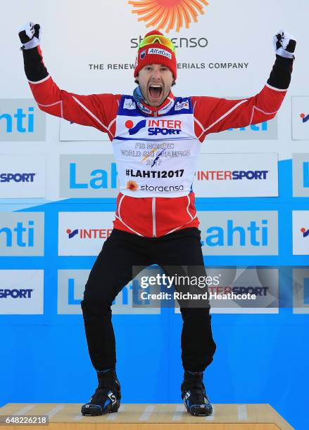 Alex Harvey of Canada celebrates winning the gold medal in the Men's Cross Country Mass Start during the flower ceromeny during the FIS Nordic World...