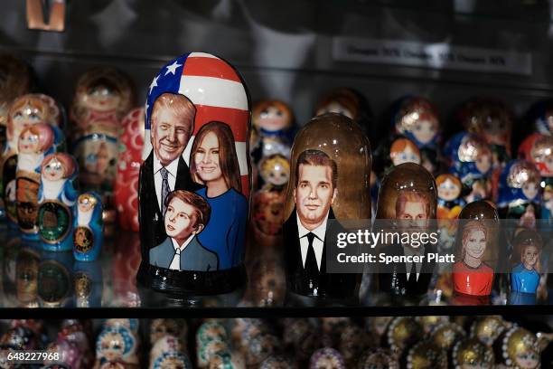 Traditional Russian nesting doll painted with the likeness of President of Donald Trump and his family is displayed for sale at a Moscow store on...
