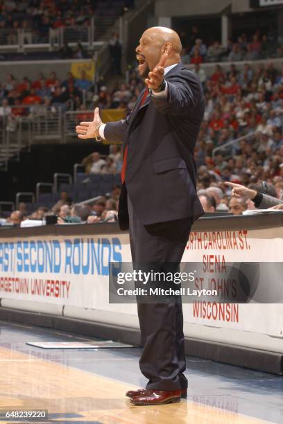 Head coach Mike Jarvis of the St. John's Redmen reacts to a call during the NCAA College Basketball Tournament 1st round game against the Wisconsin...