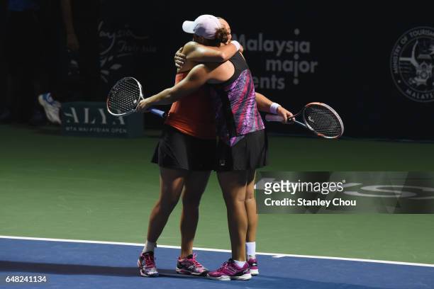 Ashleigh Barty and Casey Dellacqua of Australia celebrates after the Doubles Final during the 2017 WTA Malaysian Open at the TPC on March 5, 2017 in...
