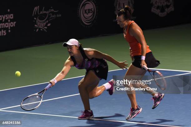 Ashleigh Barty and Casey Dellacqua of Australia in actions in the Doubles Final during the 2017 WTA Malaysian Open at the TPC on March 5, 2017 in...