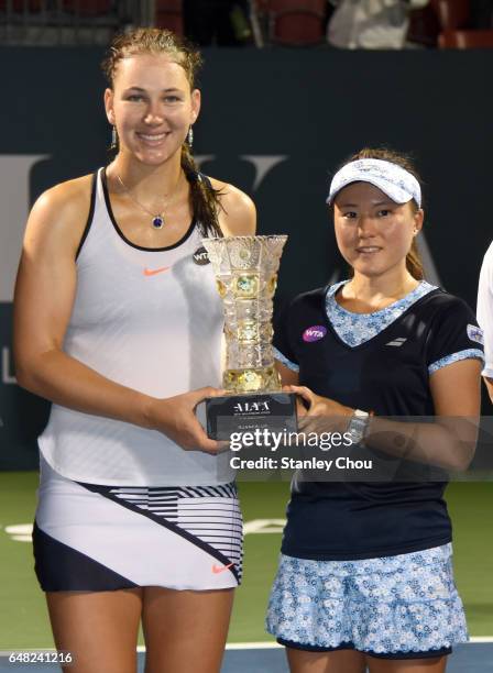 Nicole Melichar of the United States and Makoto Ninimiya of Japan poses with the Runners Up Douubles Trophy during the 2017 WTA Malaysian Open at the...