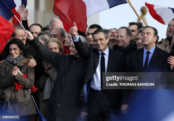 French presidential election candidate for the right-wing Les Republicains party Francois Fillon , flanked by his wife Penelope Fillon , his daughter...