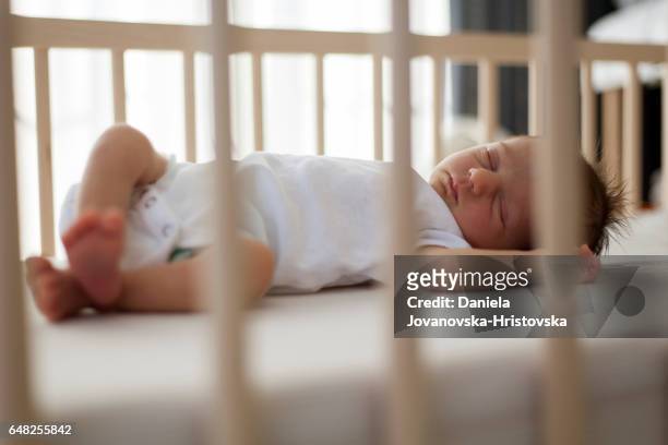 baby sleeping - crib stock pictures, royalty-free photos & images
