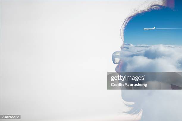 double exposure portrait of an asian woman combined with blue sky and aircraft flying over the sky - faces collage stock pictures, royalty-free photos & images