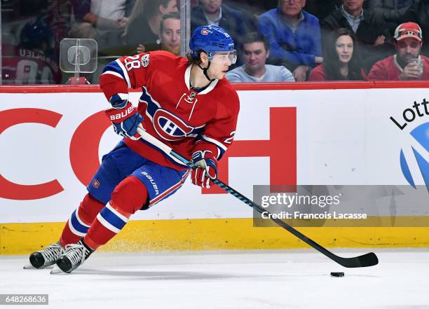 Nathan Beaulieu of the Montreal Canadiens skates with the puck against the New York Islanders in the NHL game at the Bell Centre on February 23, 2017...