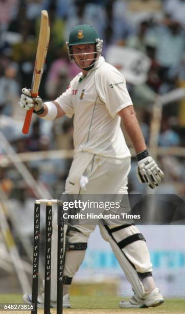 Cricket - India vs South Africa - First Test Match at Chidambaram Stadium - South Africa's opener Graeme Smith raises his bat after his half century...