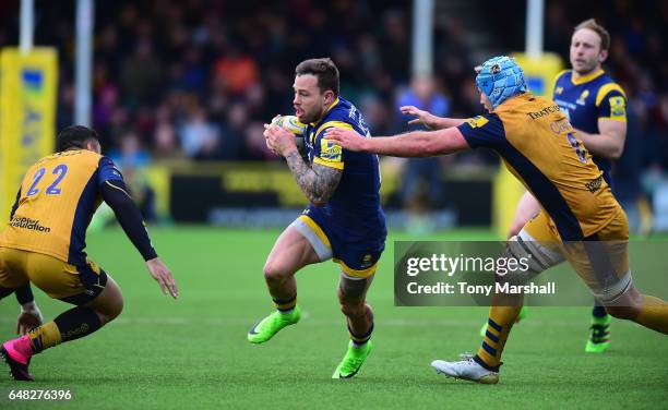 Francois Hougaard of Worcester Warriors is tackled by Jordan Crane of Bristol Rugby during the Aviva Premiership match between Worcester Warriors and...