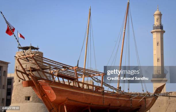 a traditional boat moored outside of al fahidi fort or dubai museum - al fahidi fort fotografías e imágenes de stock