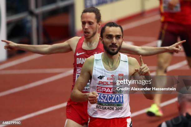 Adam Kszczot of Poland celebrates as he crosses the finish line to win the gold medal during the Men's 800 metres final on day three of the 2017...